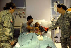 4th Regiment troops deliver Christmas cheer to the children at Cook Children's Hospital in Fort Worth, Texas.Photo by PV2 Byron Sims
